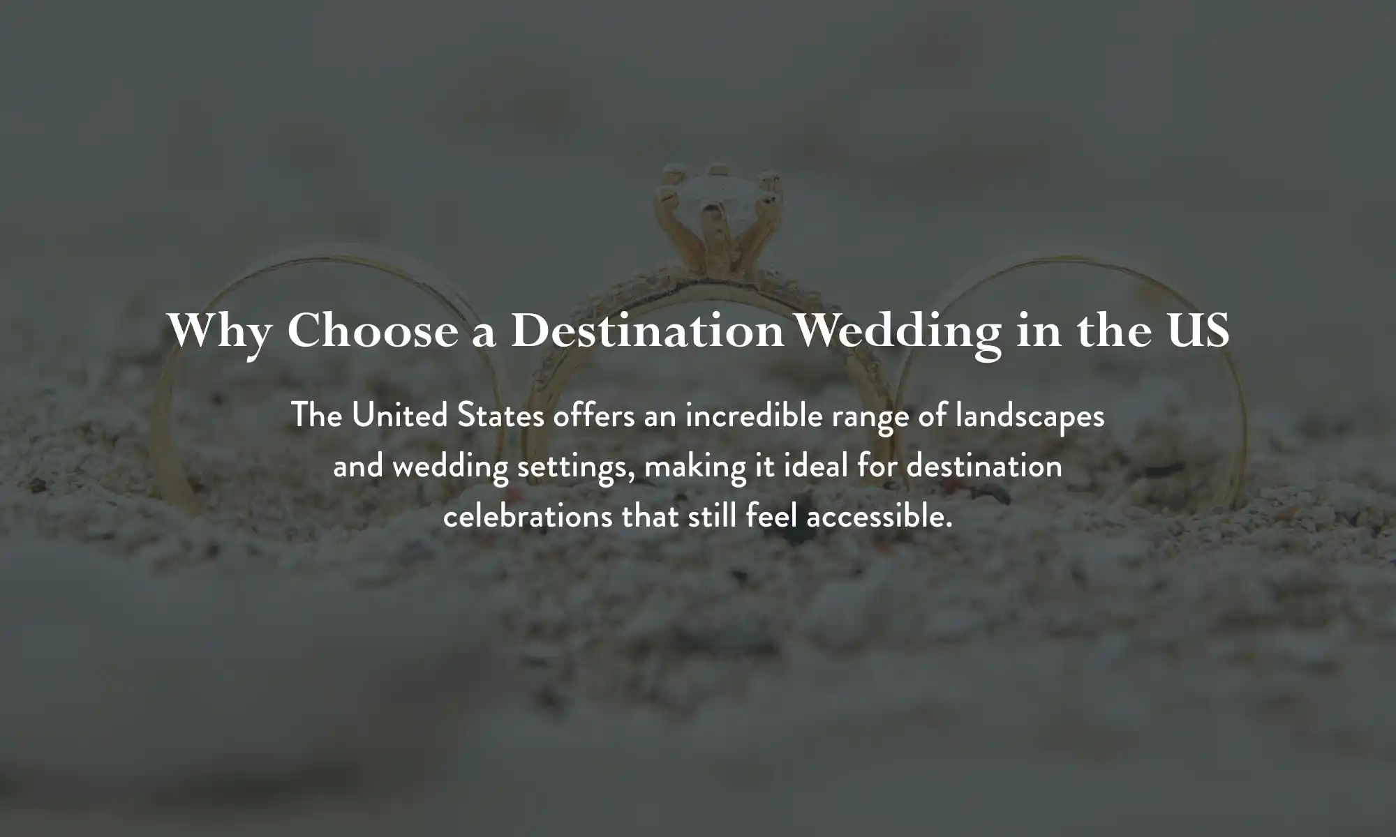 Wedding rings on sand representing destination weddings in the US.
